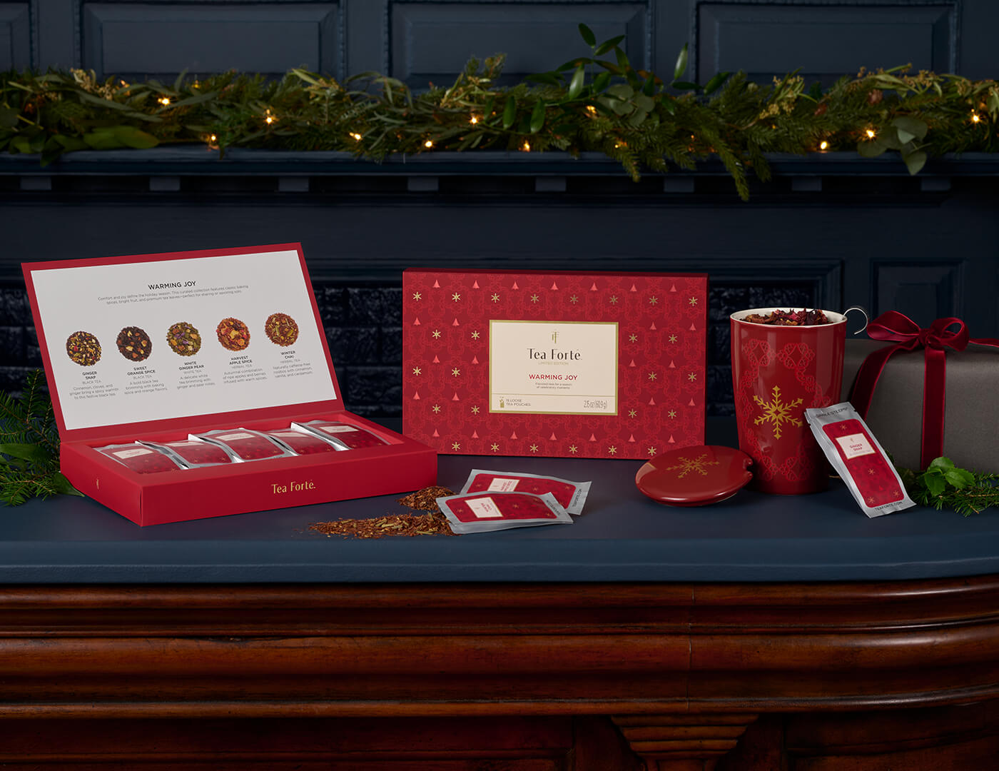 Single Steeps Sampler Warming Joy, closed and open with KATI Steeping Cup and loose tea pouches on a counter